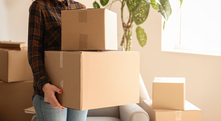 person with moving boxes